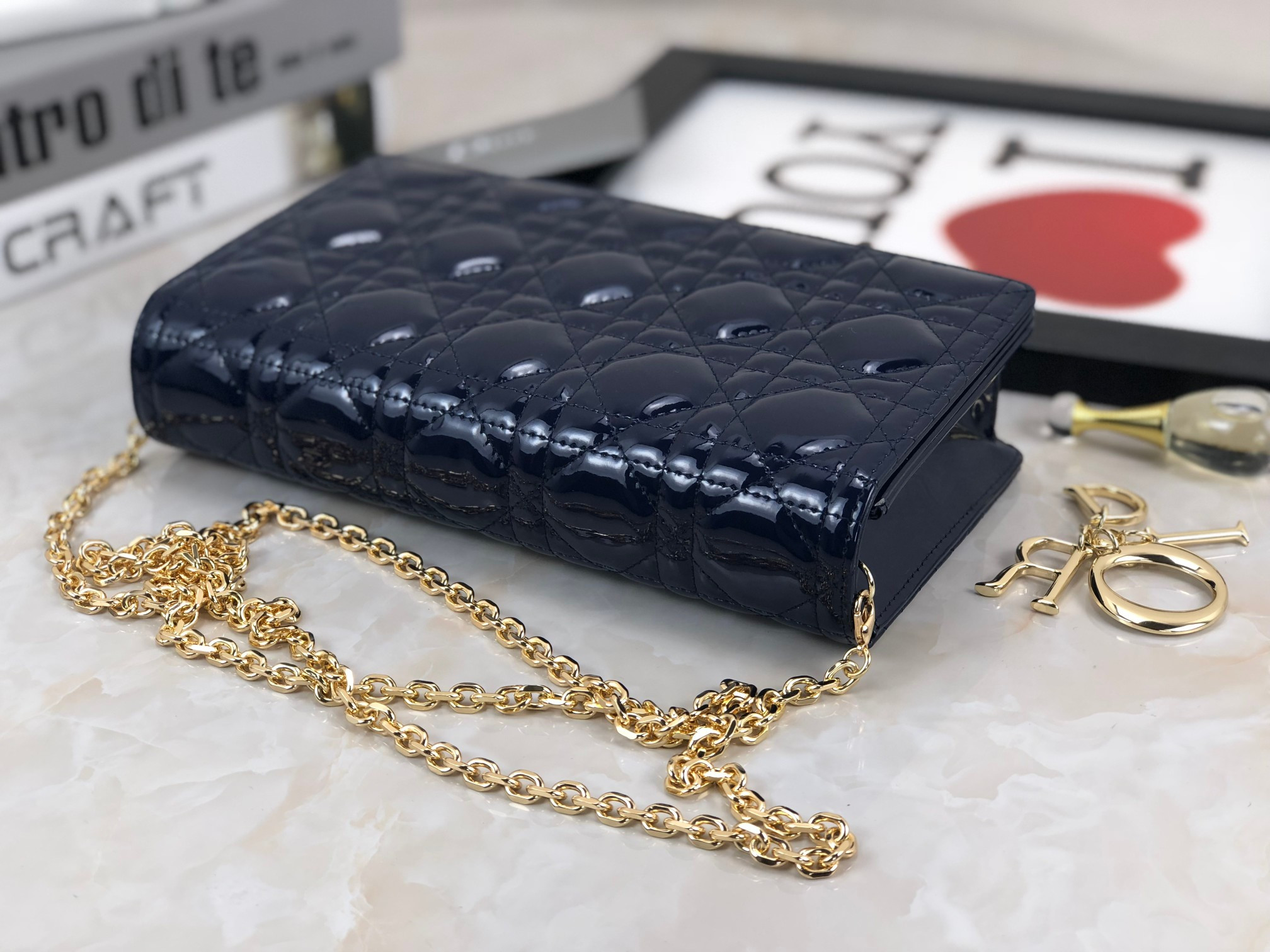 lady D*or pouch  navy patent cannage calfskin 8.5 x 4.5 x 1 inches