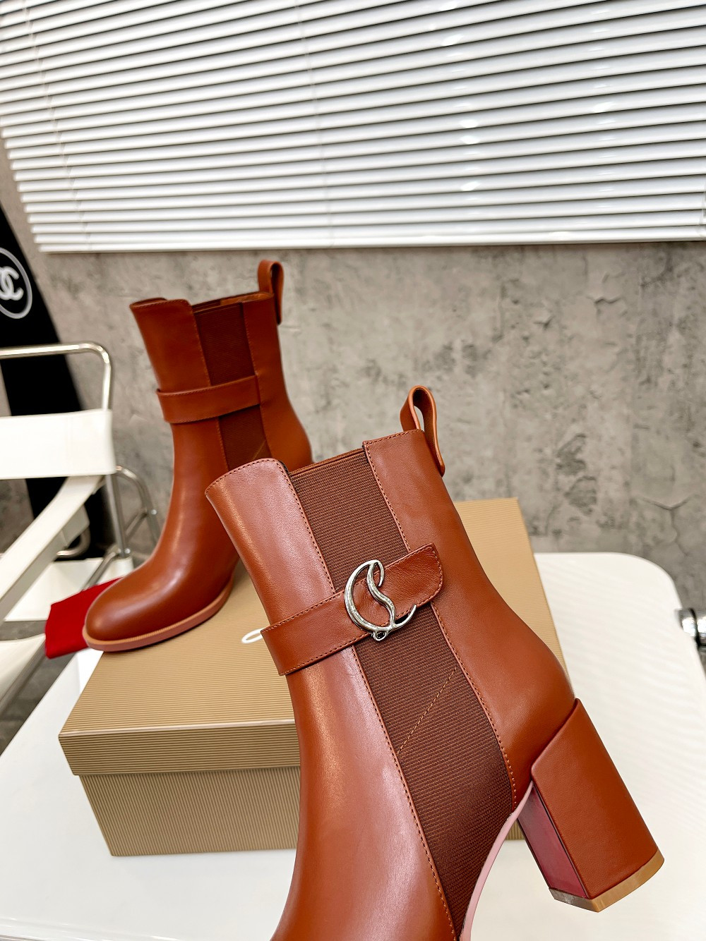 UA Ch**an Louboutin (CL) launched a new collection of chunky heeled platform boots